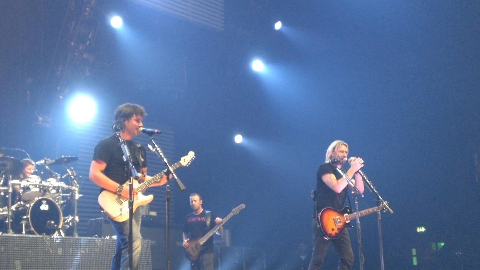 Nickelback performing onstage at Wembley Arena